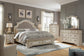 Realyn Queen Upholstered Bed with Mirrored Dresser